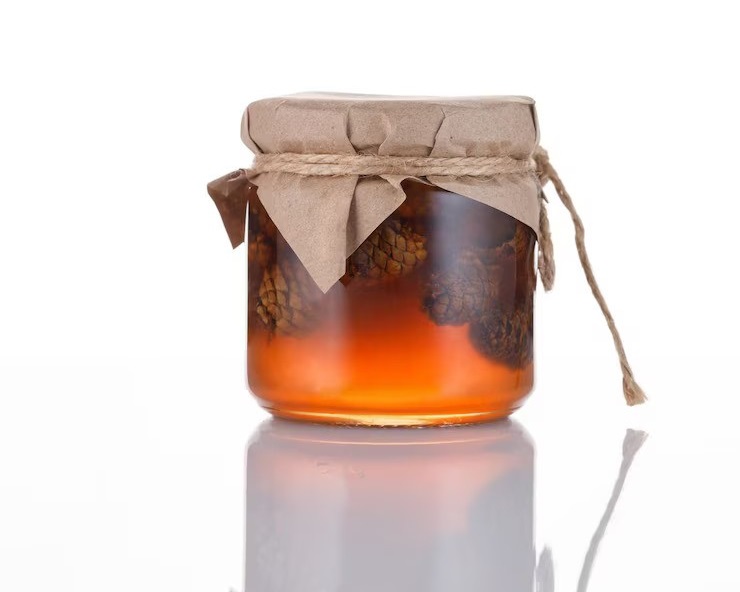 Jar honey with cones isolated white background 126732 1049 ezgif.com avif to jpg converter